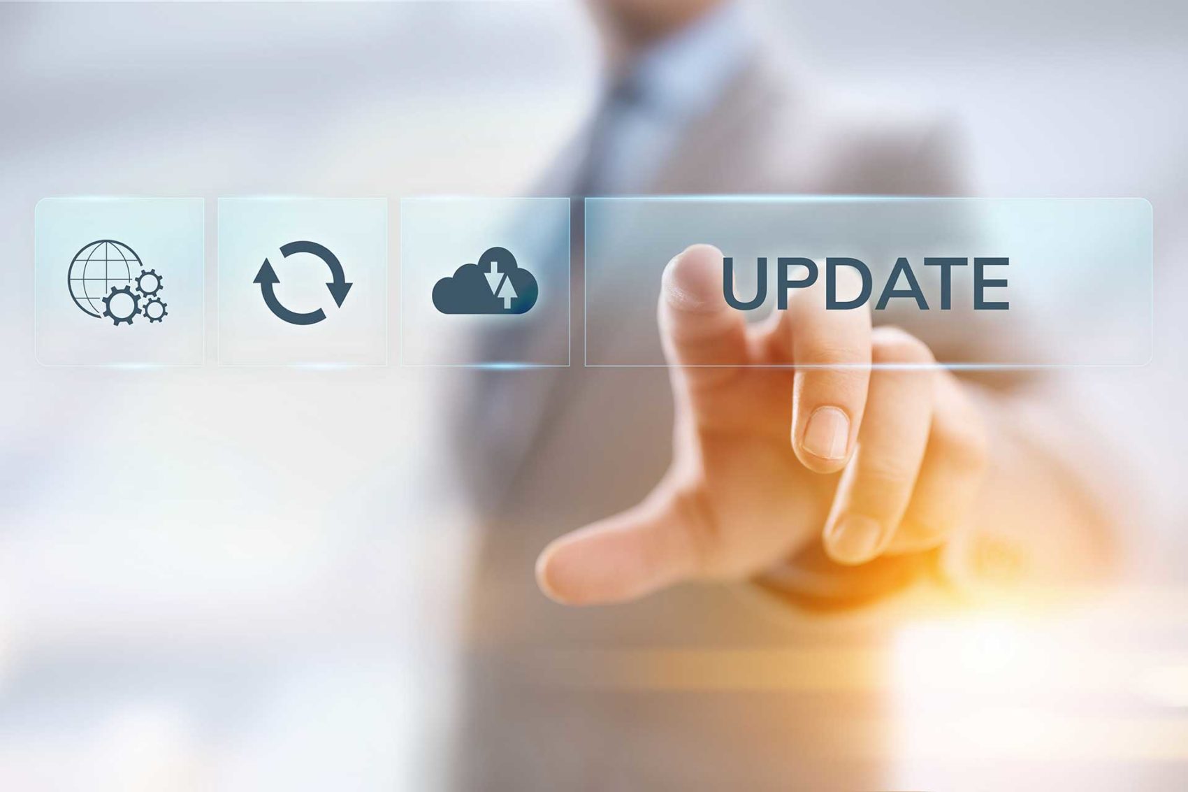 Man in a suit blurred out pressing a glass screen with an Update button icon